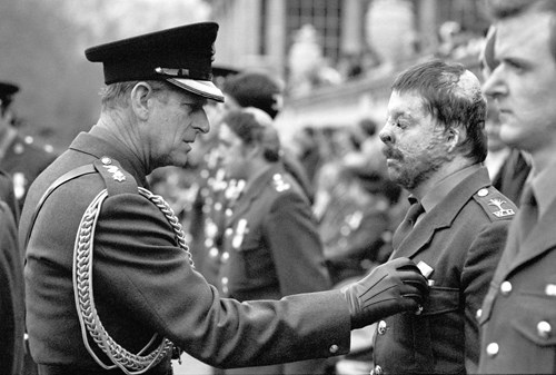 Simon Weston on parade, inspected by the Duke of Edinburgh